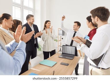 Happy office audience celebrating reward recognition, employer applauding on hr meeting, excited worker getting promotion, recognition, appreciate, respect, applause of colleagues introducing new plan - Powered by Shutterstock