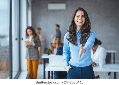 Happy office employee giving hand for shaking . Arm of business woman offering handshake. Professional welcoming colleague or new partner. HR manager hiring greeting at job interview. Close up shot - Powered by Shutterstock