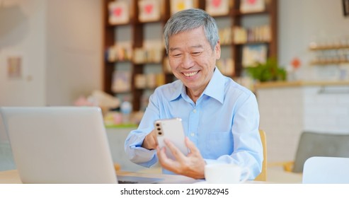 Happy Old Asian Man Working In Coffee Shop Have Achieved Good Results