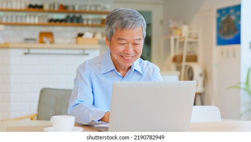 Happy Old Asian Man Working In Coffee Shop Have Achieved Good Results