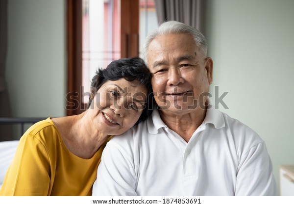 Happy old asian senior couple taking care of each\
other, to have and to hold, from this day forward, for better, for\
worse, for richer, for poorer, in sickness and in health, until\
death do us part