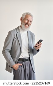 Happy Old Business Man, Smiling Senior Older Businessman Professional Wearing Suit Holding Cell Phone Using Smartphone Mobile App Standing Isolated On White Background Looking At Camera. Vertical