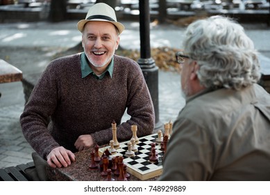 Happy Old Chess Player Relaxing In Park