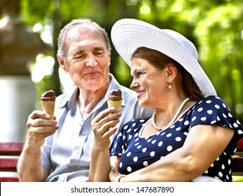 Happy Old Couple Eating Ice-cream Outdoor.