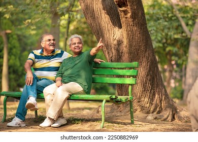 happy Old couple spending time together and watching some opposite site and pointing there. - Powered by Shutterstock