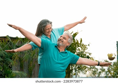 Happy Old couple spreading hand and spending time together. - Powered by Shutterstock