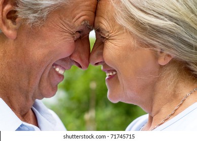 Happy Old Couple In A Summer Park