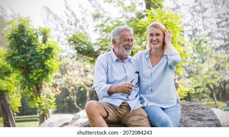 Happy Old Elderly Caucasian Couple Smiling In Park On Sunny Day, Hoot Senior Couple Relax In Spring Summer Time. Healthcare Lifestyle Elderly Retirement Love Couple Together Valentines Day Concept 