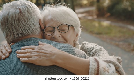 Happy Old Enjoying Day In Park. Senior Man Flirting With Elderly Woman. Dance In Autumn Day. High Quality Photo