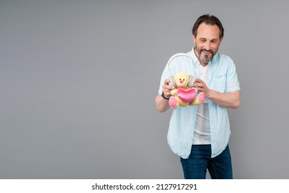 Happy Old Man Hold Musical Dj Teddy Bear In Headphones Grey Background Copy Space, Valentines Day