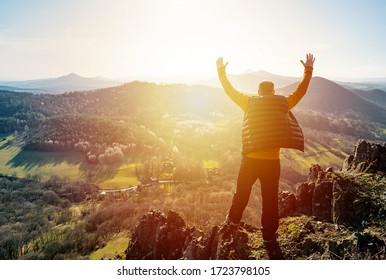 Happy Old Man Just Reaches The Top Of Hill. Handsome Senior To The Mountain Top Against Backdrop Of Sunset. Valley Watching Sunset In Last Sun Rays. Discovery, Travel, Adventure
