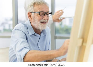 Happy Old Man Painting On Canvas As A Hobby Mindfulness.