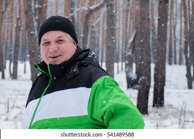 Happy Old Man In The Winter Forest