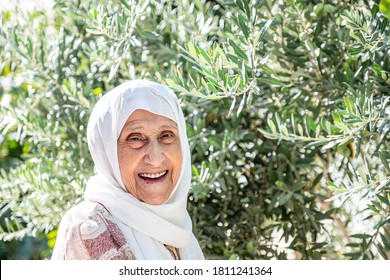 Happy Old Woman In The Garden