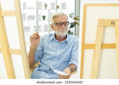 Happy Older, Caucasian Mature, Adult And Retirement Having Pleasure, Painting Picture On Canvas At Home. Freetime, Relaxed Lifestyle Of People.