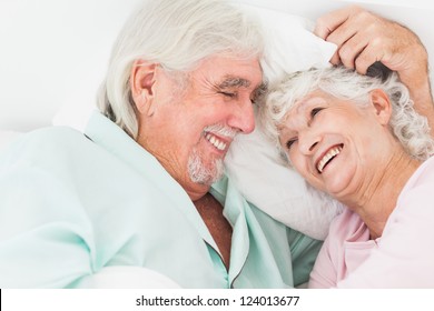 Happy Older Couple In Bed