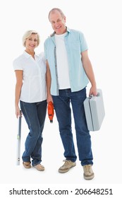 Happy Older Couple Holding Diy Tools On White Background