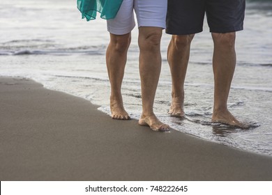 Happy Older Couple On The Beach