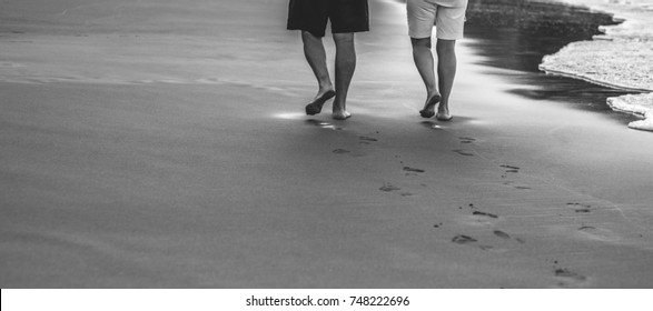 Happy Older Couple On The Beach