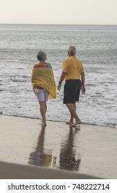 Happy Older Couple On The Beach