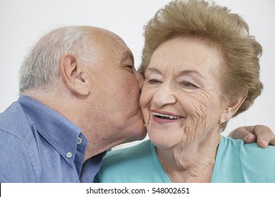 Happy Older Couple Still In Love And Playing And Being Silly