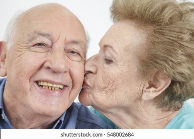 Happy Older Couple Still In Love And Playing And Being Silly