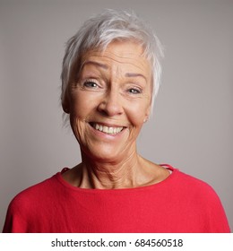 Happy Older Woman In Her 60s With Trendy Short White Hair Laughing