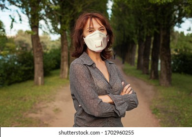 Happy Older Woman In Medical Mask Outdoors