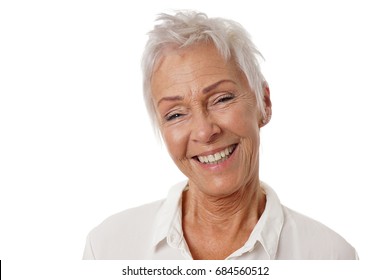 Happy Older Woman With Trendy Short White Hair And Toothy Smile. Isolated On White