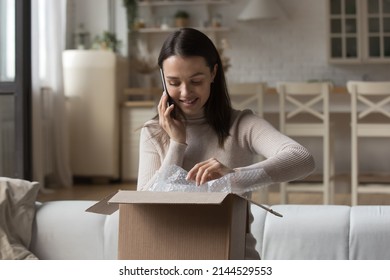 Happy Parcel Receiver Girl Opening Box, Unwrapping Parcel, Talking To Delivery Service On Mobile Phone, Ordering Courier, Giving Feedback To Internet Shop, Answering Cellphone Call