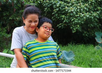 Happy Parent And Child In The Green Park