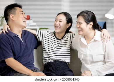 Happy Parent And Teenager,father Mother And Daughter Have Fun Enjoy Free Time On Weekend,asian Family Laughing Playing Together Sitting On Couch In Living Room,lifestyle,moment Of Warmth And Happiness