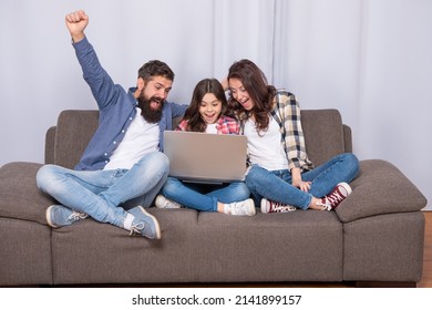 Happy Parents With Kid Girl Study Online. Mom Dad And Daughter Shopping On Cyber Monday.