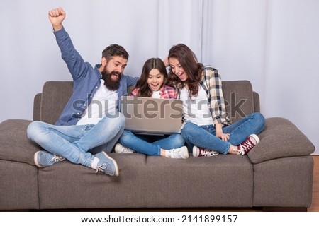 happy parents with kid girl study online. mom dad and daughter shopping on cyber monday.