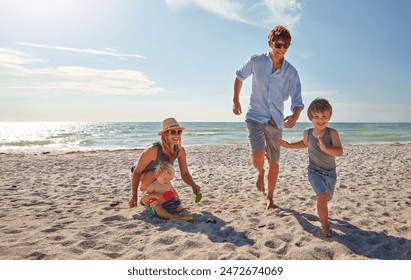 Happy, parents and kids playing on the beach on family holiday, vacation or adventure in summer. Boy, father and kids with outdoor ocean for fun energy and happiness with a game while running - Powered by Shutterstock