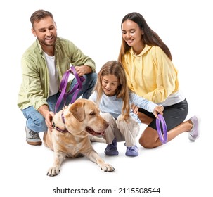 Happy parents with little daughter and cute Labrador dog on white background - Powered by Shutterstock