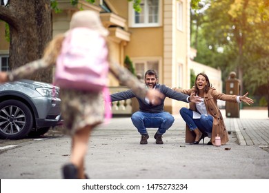 Happy Parents Pickup Her Daughter From School