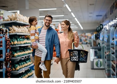 Happy parents and their small daughter enjoying in shopping day at supermarket.  - Shutterstock ID 2189403507