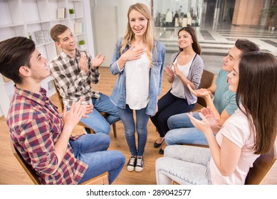 Happy Patient Has A Breakthrough In Group Therapy While Others Are Clapping Her.