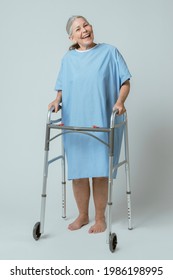 Happy Patient In A Hospital Gown With A Zimmer Frame