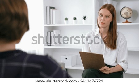Happy patient and psychologist exchanging mental health conversation in clinic with positive emotion while explaining prim successful work and life to psychologist at psychologist clinic office