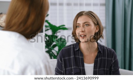 Happy patient and psychologist exchanging mental health conversation in clinic with positive emotion while explaining prim successful work and life to psychologist at psychologist clinic office Stock foto © 