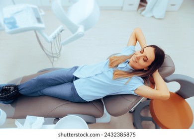 

Happy Patient Sitting Comfortable in a Dental Office 
Carefree relaxed woman sitting in a dentist cabinet with no fear
 - Powered by Shutterstock