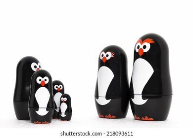 Happy penguin toy figure parent with adorable kids.