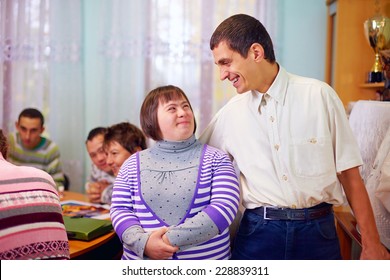 happy people with disability in rehabilitation center