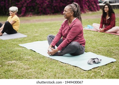 Happy People Doing Yoga Class At City Park - Focus On African Woman Face