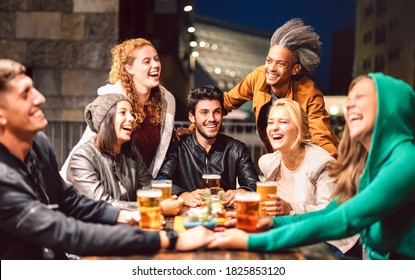 Happy People Drinking Beer At Brewery Bar Out Doors - Friendship Lifestyle Concept With Young Friends Enjoying Time Together At Open Air Pub - Dark Color Tones On Vivid Filter