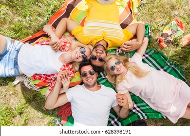 Happy People Group Young Friends Lying Down On Picnic Blanket Outdoor, Two Couple Summer Sunny Day Smile Top Angle View