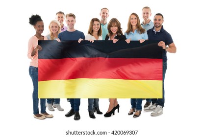 Happy People Holding German Flag Against White Background