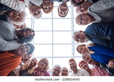 Happy People Looking Down At Camera